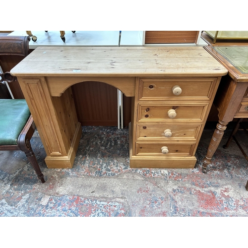 19 - A modern solid pine dressing table with four drawers - approx. 75cm high x 112cm wide x 43cm deep