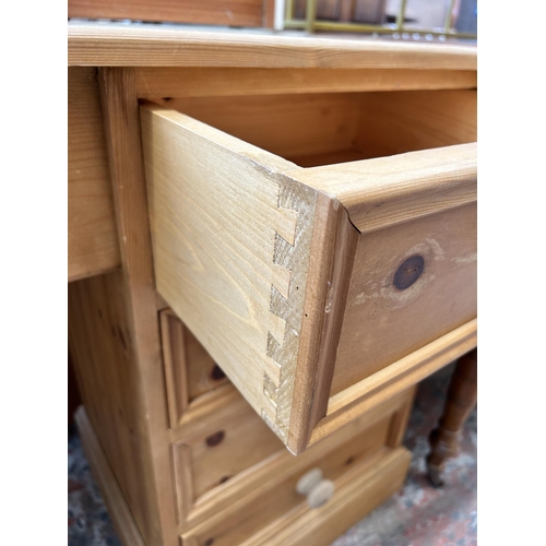 19 - A modern solid pine dressing table with four drawers - approx. 75cm high x 112cm wide x 43cm deep