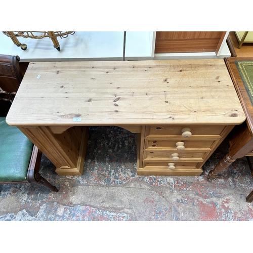 19 - A modern solid pine dressing table with four drawers - approx. 75cm high x 112cm wide x 43cm deep