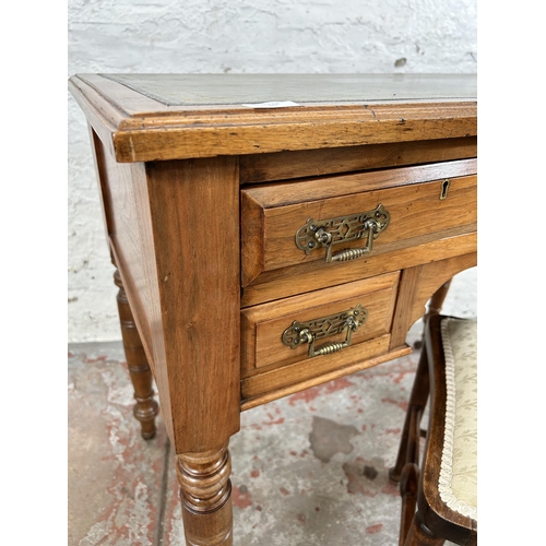 20 - A late 19th century Aesthetic Movement walnut writing desk with two long drawers, two short drawers,... 