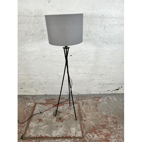 22 - A modern black metal tripod floor lamp with grey fabric shade - approx. 136cm high