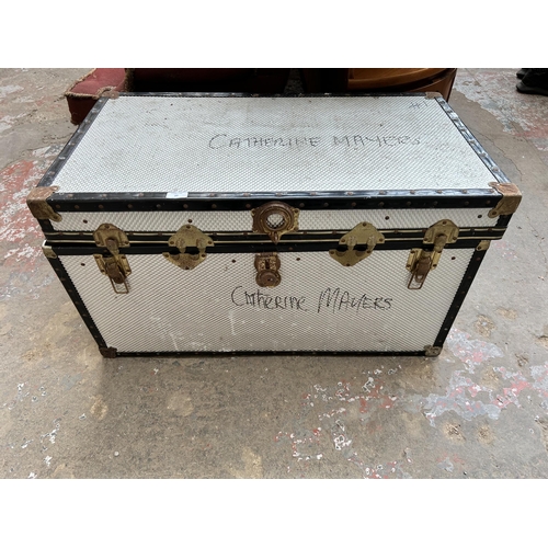 27 - A mid 20th century silver and black painted travel trunk