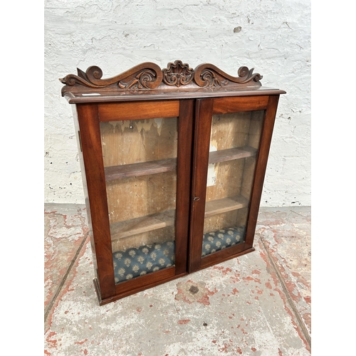 29 - An Edwardian mahogany wall mountable display cabinet with two glazed doors