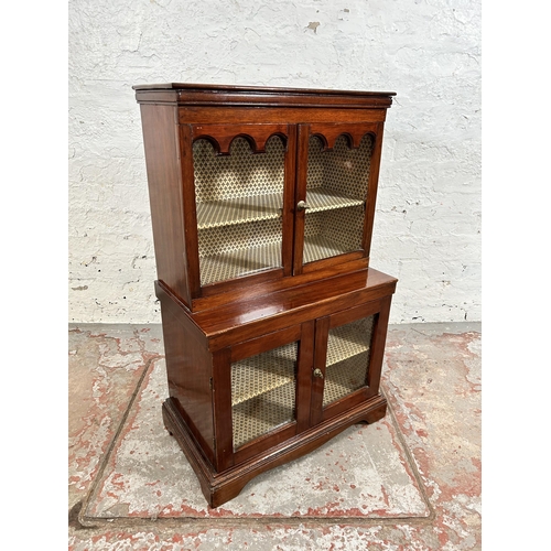 31 - An early 20th century mahogany miniature apprentice display cabinet with four glazed doors - approx.... 