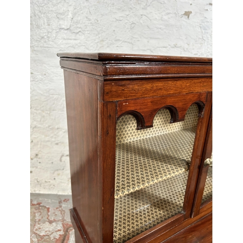 31 - An early 20th century mahogany miniature apprentice display cabinet with four glazed doors - approx.... 