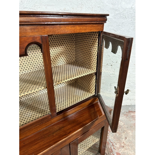 31 - An early 20th century mahogany miniature apprentice display cabinet with four glazed doors - approx.... 