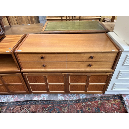 32 - A 1970s Nathan teak sideboard with four drawers and two cupboard doors - approx. 75cm high x 102cm w... 