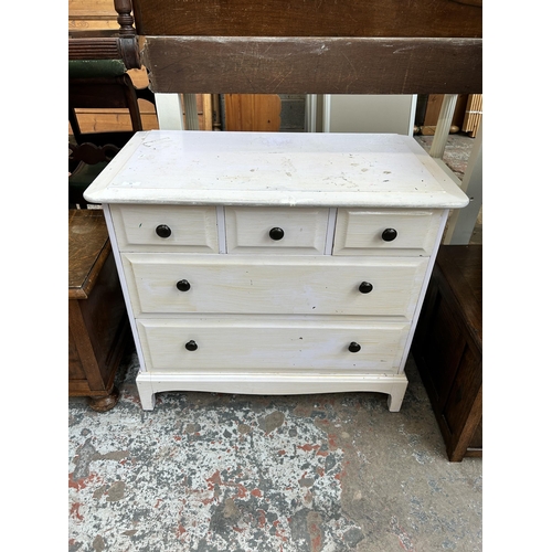 39 - A Stag Minstrel white painted chest of three short over two long drawers