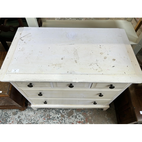 39 - A Stag Minstrel white painted chest of three short over two long drawers