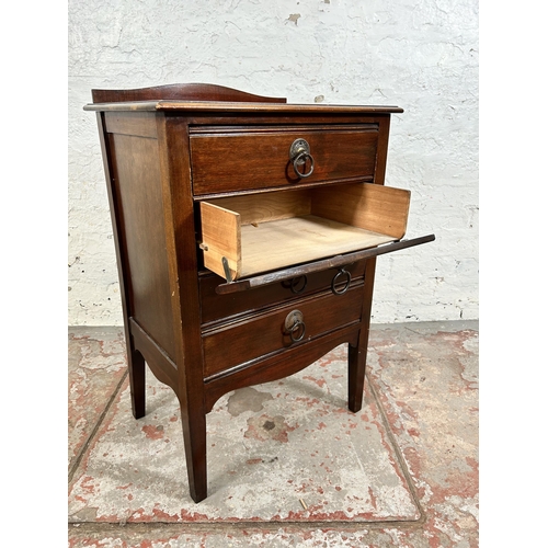 40 - An Edwardian mahogany four drawer music cabinet - approx. 81cm high x 53cm wide x 38cm deep