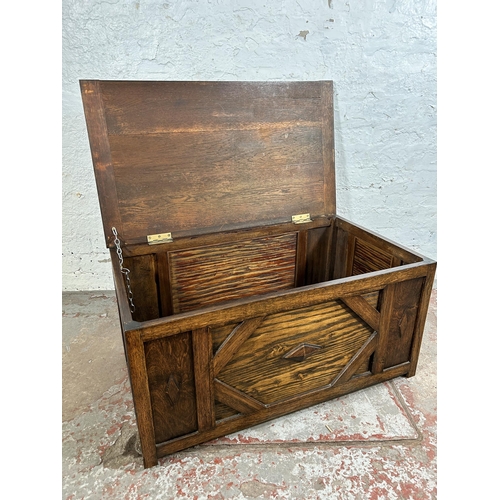 41 - A carved oak blanket box - appox. 41cm high x 84cm wide x 48cm deep