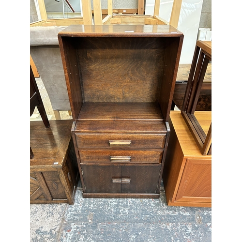 42 - An Art Deco oak bookcase cabinet with single shelf, two drawers and two cupboard doors - approx. 110... 