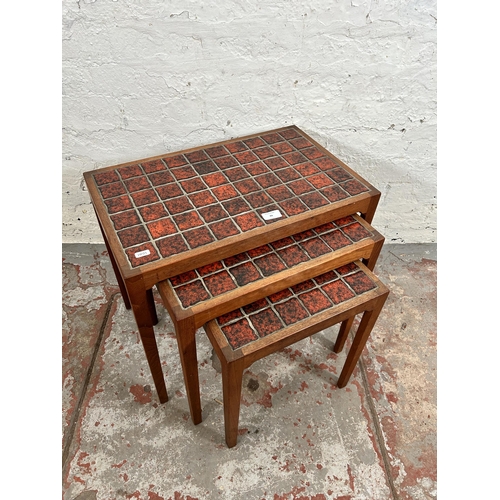 44 - A 1960s BR Gelsted of Denmark teak nest of three tables with red ceramic tile inserts - approx. 48cm... 