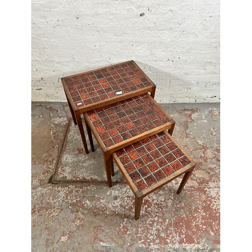 44 - A 1960s BR Gelsted of Denmark teak nest of three tables with red ceramic tile inserts - approx. 48cm... 