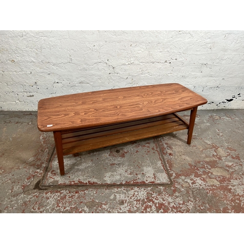 56 - A teak rectangular two tier coffee table