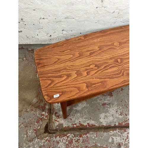 56 - A teak rectangular two tier coffee table