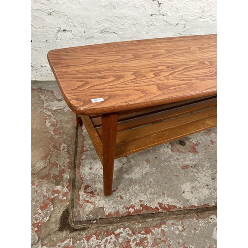 56 - A teak rectangular two tier coffee table