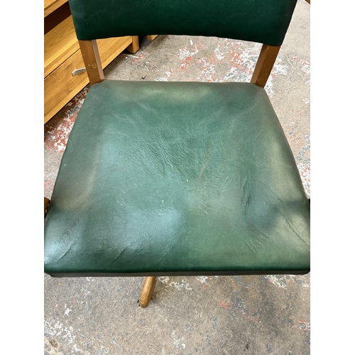 60 - A mid 20th century beech and green vinyl office desk chair