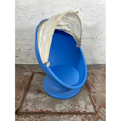 64 - An IKEA blue plastic swivel outdoor child's chair