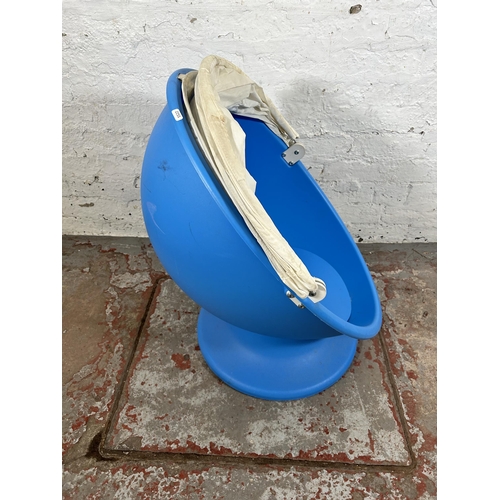 64 - An IKEA blue plastic swivel outdoor child's chair