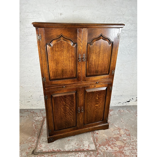 68 - A Royal Oak drinks cabinet with four doors and fitted interior - approx. 139cm high x 86cm wide x 45... 