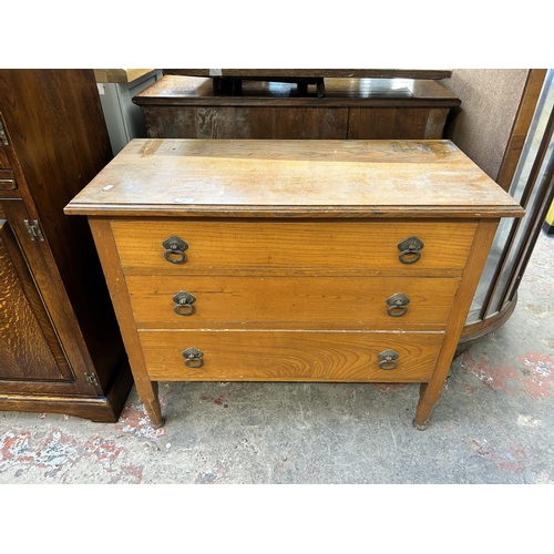 70 - An early 20th century oak chest of three drawers