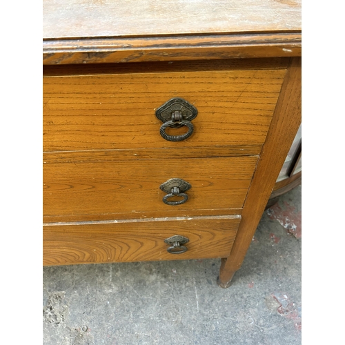 70 - An early 20th century oak chest of three drawers