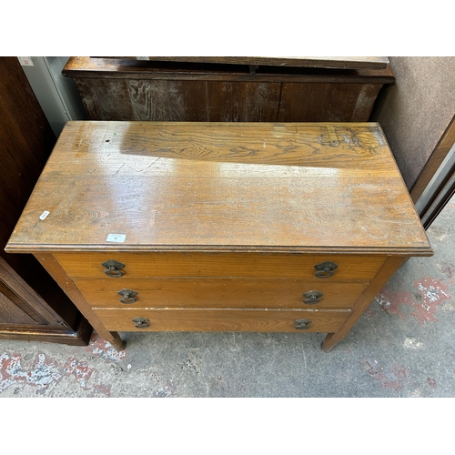 70 - An early 20th century oak chest of three drawers