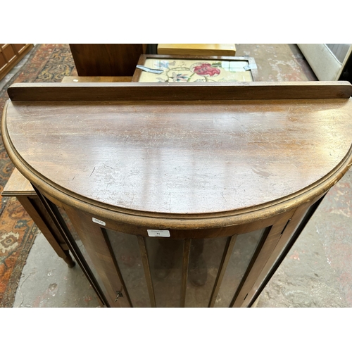 71 - A walnut bow fronted display cabinet with one internal glass shelf