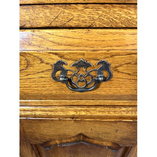 72 - A Royal Oak sideboard with two drawers and two cupboard doors - approx. 84cm high x 96cm wide x 50cm... 