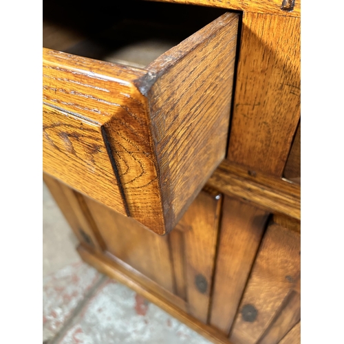 72 - A Royal Oak sideboard with two drawers and two cupboard doors - approx. 84cm high x 96cm wide x 50cm... 