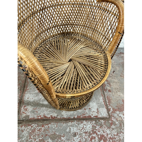 74 - A wicker peacock chair - approx. 112cm high x 84cm wide x 48cm deep