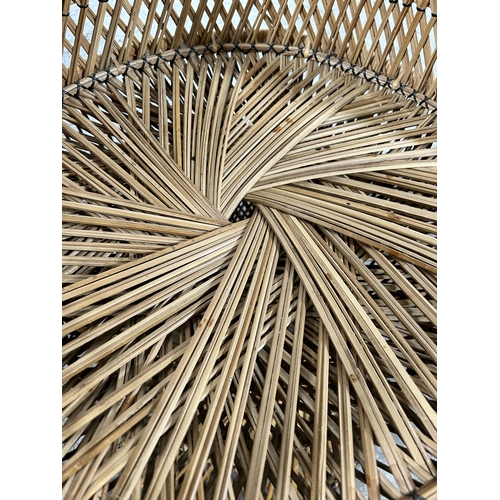 74 - A wicker peacock chair - approx. 112cm high x 84cm wide x 48cm deep