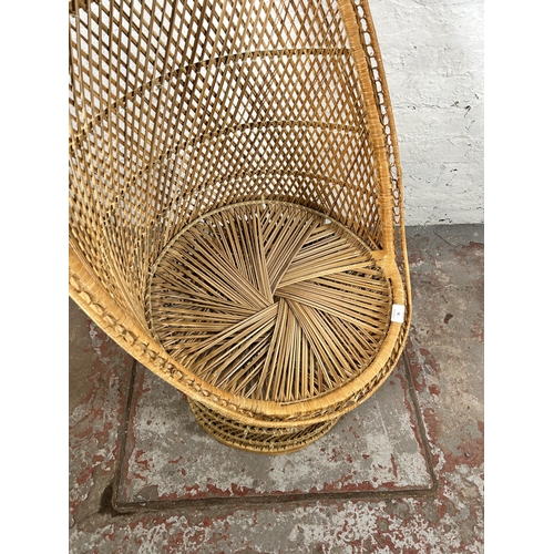 75 - A wicker high back tub chair - approx. 110cm high x 56cm wide x 48cm deep