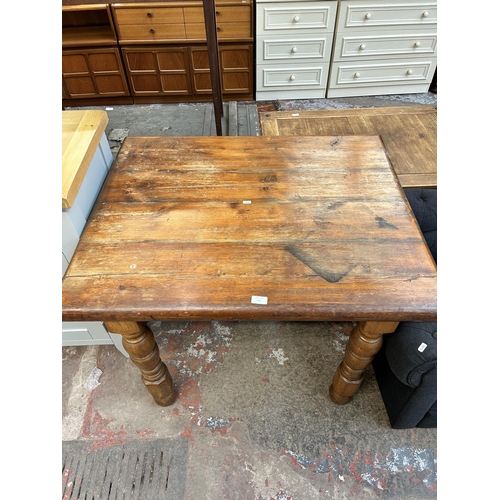 77 - A pine rectangular farmhouse kitchen table - approx. 75cm high x 79cm wide x 98cm long