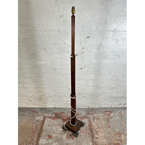 8 - An Art Deco oak standard lamp - approx. 156cm high