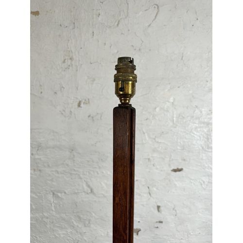 8 - An Art Deco oak standard lamp - approx. 156cm high