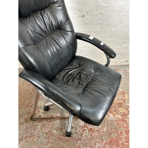 83 - A modern black leatherette swivel office desk chair