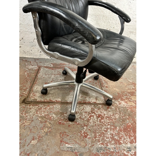 83 - A modern black leatherette swivel office desk chair