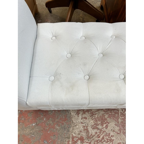 84 - A modern white fabric upholstered storage bench