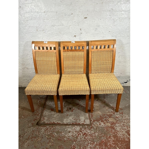 86 - A set of four MGM pine and wicker dining chairs