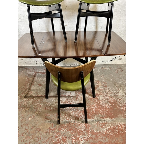 90 - A G Plan tola wood and black painted dining table and three matching chairs