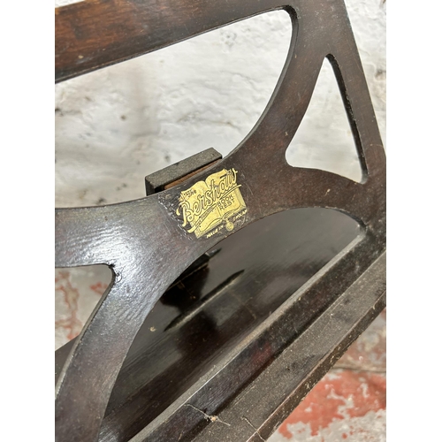 123 - Two pieces of furniture, one 1920s Bershaw bookrest and one oak two section magazine rack