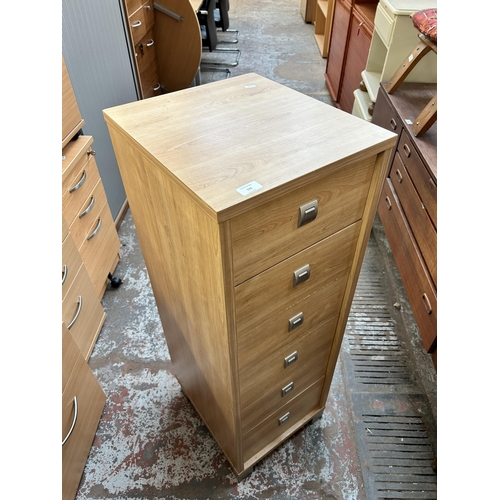 131 - A modern oak effect chest of six drawers - approx. 113cm high x 39cm wide x 44cm deep