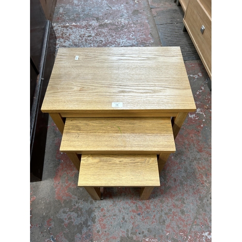 136 - A modern oak nest of three tables - approx. 47cm high x 32cm wide x 34cm deep