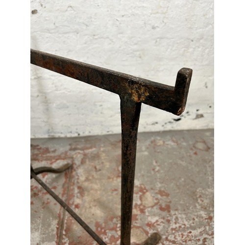 141 - Two 19th century wrought iron trestles - largest approx. 76cm high x 44cm wide x 76cm long