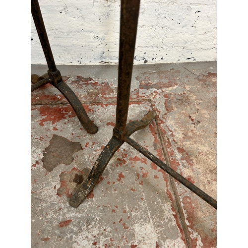 141 - Two 19th century wrought iron trestles - largest approx. 76cm high x 44cm wide x 76cm long