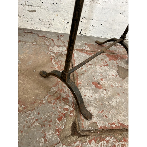 141 - Two 19th century wrought iron trestles - largest approx. 76cm high x 44cm wide x 76cm long