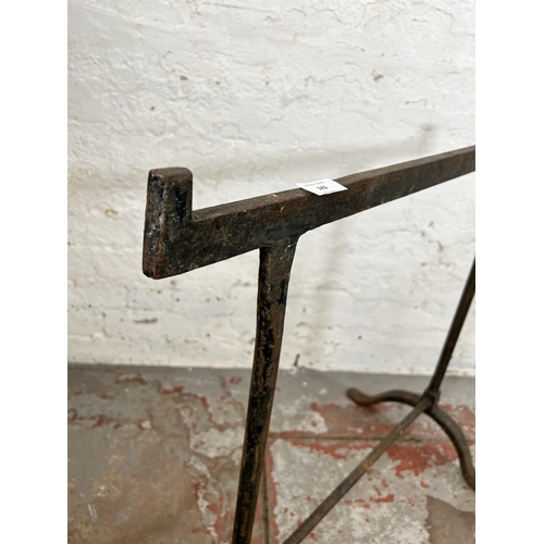 141 - Two 19th century wrought iron trestles - largest approx. 76cm high x 44cm wide x 76cm long