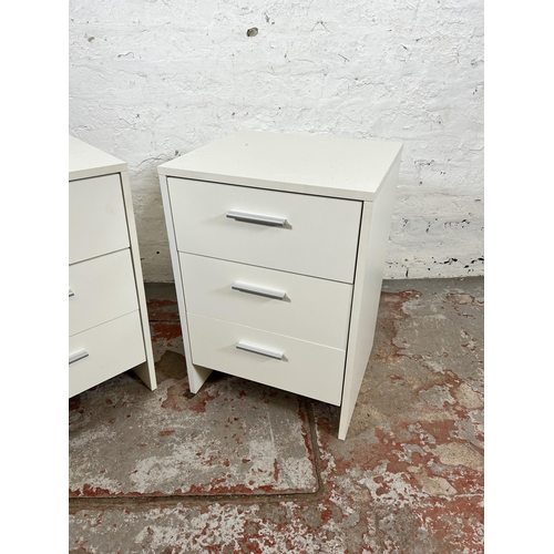 158 - A pair of modern white laminate bedside chest of three drawers - approx. 58cm high x 40cm wide x 35c... 